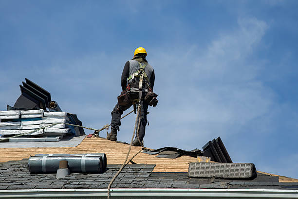 Professional Roof Replacement technician working in Buxton, NC